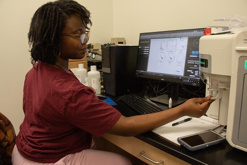 Student working with scientific equipment